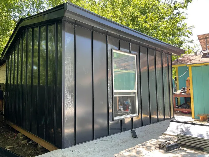 Black standing seam metal wall panels for Metal Roof Installation in Town and Country